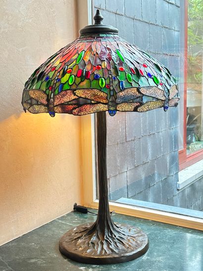 null Tiffany-style lamp. Beautiful bronze base with brown patina. Shade decorated...
