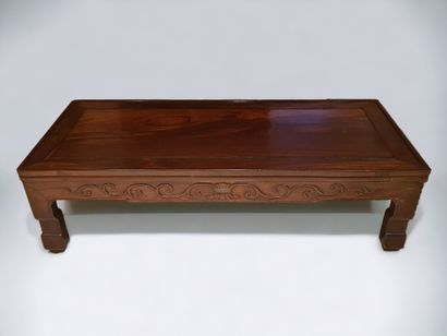 null China, circa 1900. A light wood "Kang Table" with a half-relief carved band...