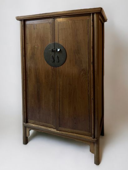 null China, late 19th century. Natural wood cabinet with two doors on four legs....