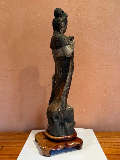 null China, second half of the 20th century.
Imitation wood statuette in reconstituted...