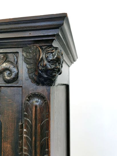 null Narrow carved wood buffet with Renaissance style decoration of cherubs' heads...