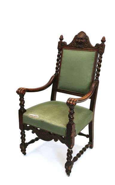 null Neo-Gothic armchair in turned and carved wood, with a high back surmounted by...