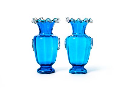 null Pair of blue tinted glass vases with flared neck with hot glued corrugated decoration...