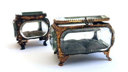 null Two reliquary boxes in embossed gilded metal and cut glass, one with the lid...