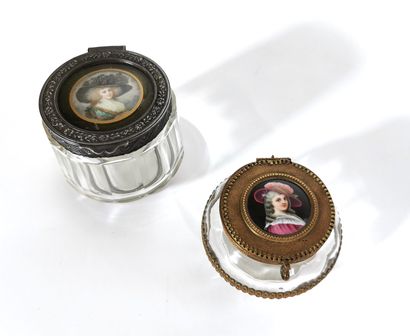 null Two stamped-mounted glass inkwells

The lids are decorated with miniatures depicting...