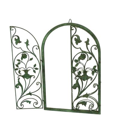 null Wrought iron wall-mounted mirror with green patina decorated with two openwork...