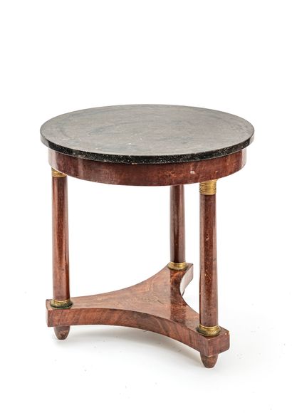 null Pedestal table in mahogany and mahogany veneer tripod, the feet encircled with...