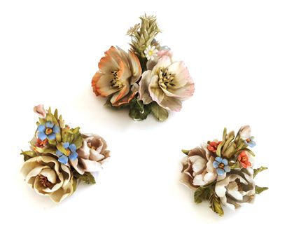 null CAPODIMONTE

Suite of three polychrome porcelain bouquets, one marked with the...