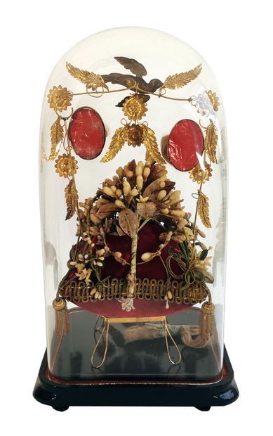 null Quadrangular bridal globe decorated with a wreath of orange blossoms resting...