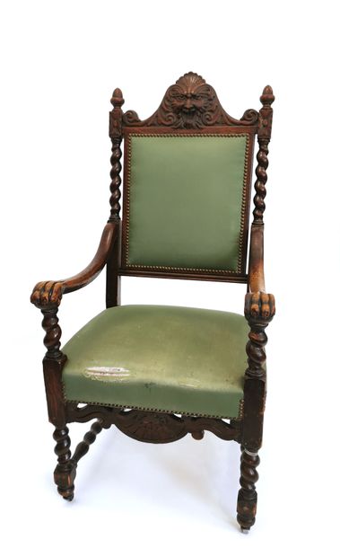 null Neo-Gothic armchair in turned and carved wood, with a high back surmounted by...
