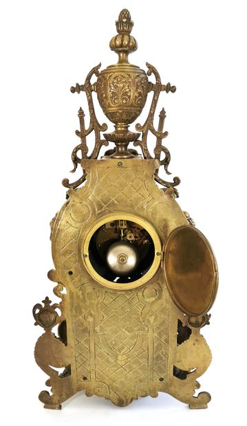 null Clock in chased bronze, gilt and brass with richly architectural decoration...