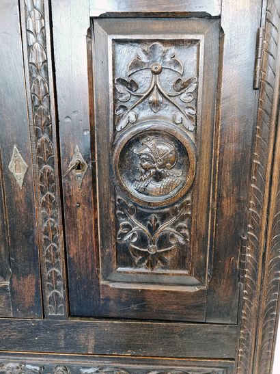 null Narrow carved wood buffet with Renaissance style decoration of cherubs' heads...