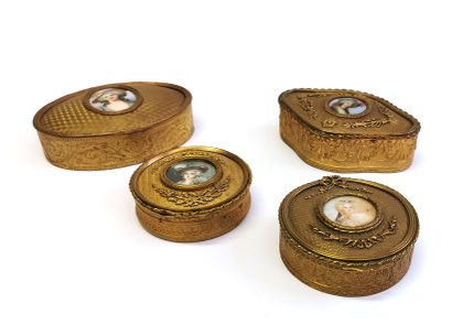 null Four neoclassical style copper and brass necklace boxes, the lids decorated...
