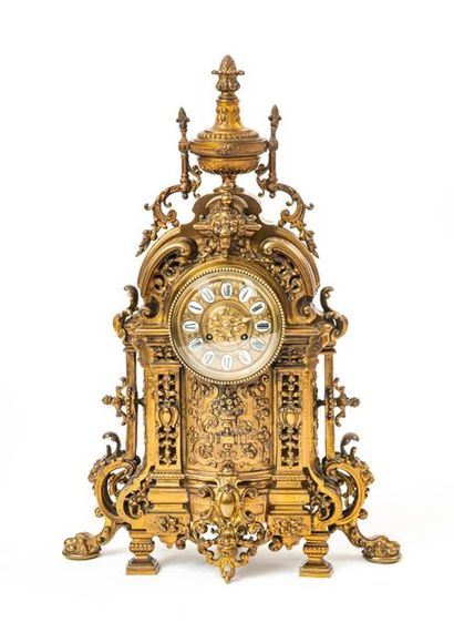 null An important bronze mantel clock with a richly decorated architectural form,...