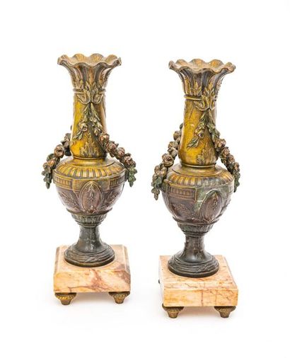 null Pair of vases in ruler patinated in imitation of bronze; the neck retaining...