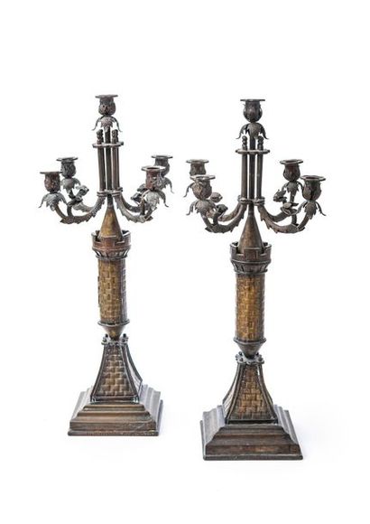 null Pair of chased copper candelabra with five lights, the shaft depicting medieval...