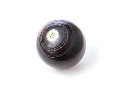 null Ebony bowling ball engraved with fillets and inlaid with two ivory circles monogrammed...