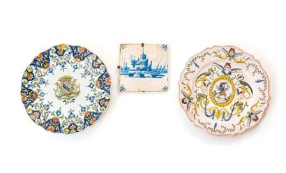 null Set of stanniferous earthenware pieces including: 
-A plate decorated with a...