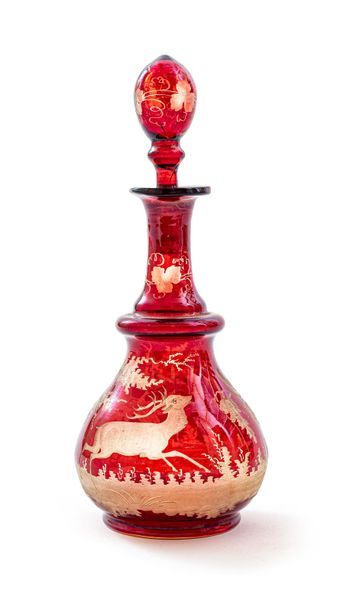 null Bohemian crystal decanter and its stopper in red shades, with pansu body and...