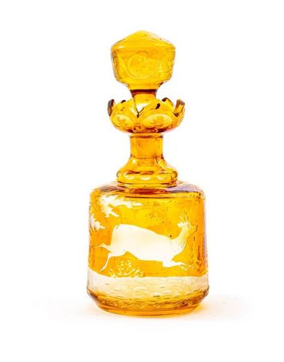 null Bohemian crystal bottle with cap in yellow shades, corolla-shaped neck
Circular...