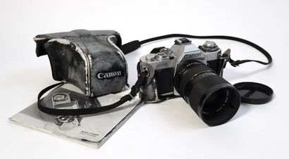 null A CANON AV-1 camera with CANON FD 35-70 mm 1:4 lens, original case and instruction...