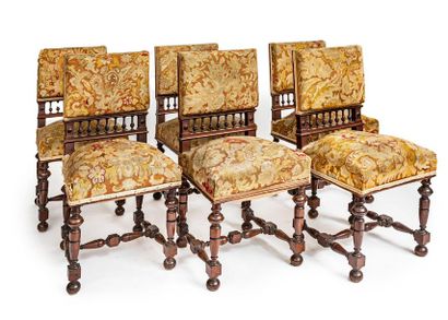null Suite of six chairs in moulded and turned walnut; the flat backrests with balusters;...