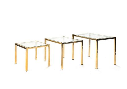 null Three nesting tables, brass frame, silver agglomerated glass tops on the outside
56...