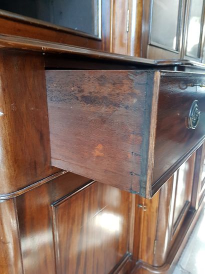 null Mahogany and mahogany veneer scriban bookcase with central projection opening...