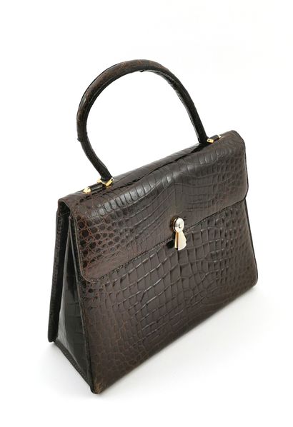 null ASTRID QUEEN

Imitation alligator handbag

H. without the handle 21.5 x W. 30.5...