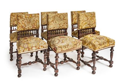 null *Suite of six chairs in moulded and turned walnut; flat backrests with balusters;...