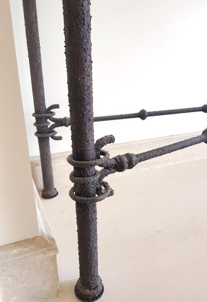 null Wrought-iron console with a material patina, quadripod base joined by an X-shaped...