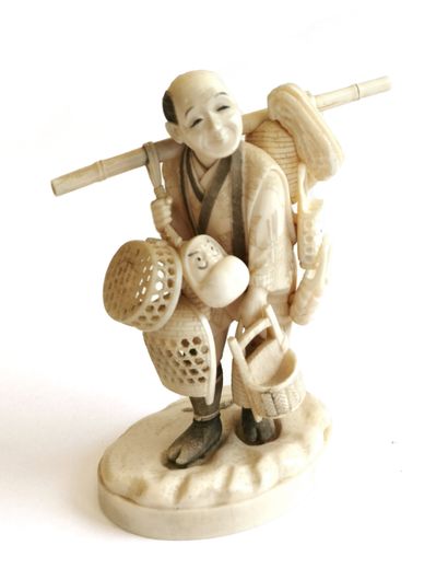 null *Japan, 1900

Carved ivory okimono showing a fisherman carrying his pots and...