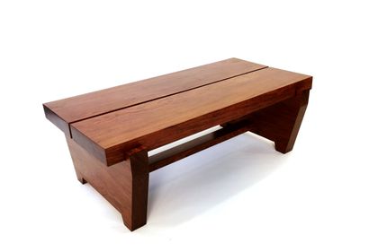 null Gabonese design circa 1980

Padouk coffee table, the top is made of two strips...