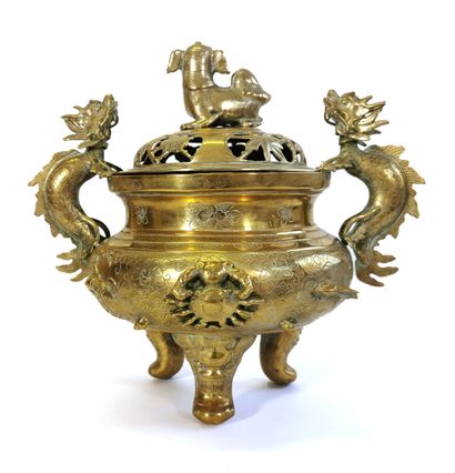 null China, 19th century

Tripod circular brass perfume burner with incised flowers...