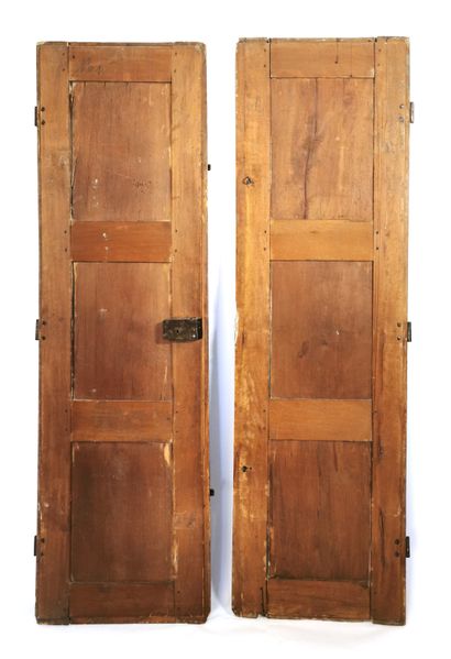 null Pair of walnut doors with moulded panel decoration, wrought iron fittings

18th...