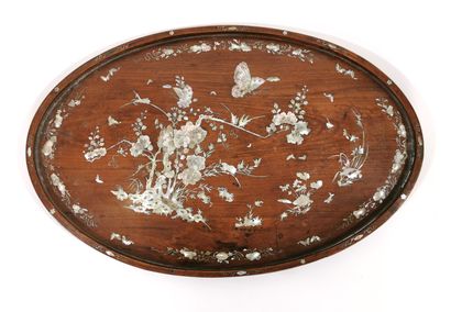 null *VIETNAM, 19th century 

Oval wooden tray inlaid with mother-of-pearl comprising...