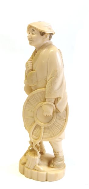 null *Japan, 1880

Carved ivory okimono showing a standing peasant carrying a bag...
