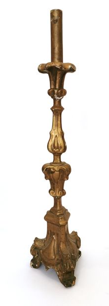 null *Candlestick made of carved and gilded wood; the trapezoidal shaft rests on...