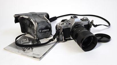 null One CANON AV-1 camera with CANON FD 35-70 mm 1:4 lens, original case and instruction...