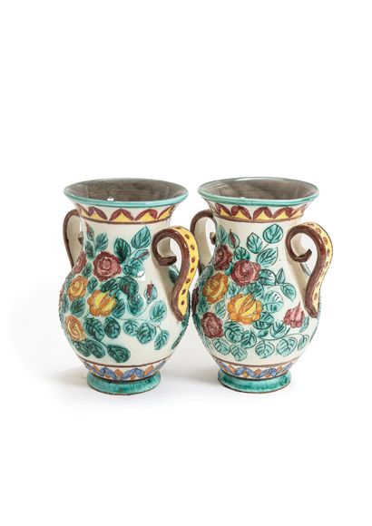 null A pair of Monaco earthenware vases of baluster shape flanked by two handles...
