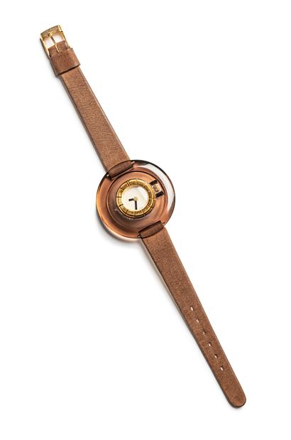 null LANVIN, circa 1975

Circular ladies' wristwatch in smoked plexiglass (signed...