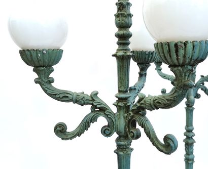null A pair of Napoleon III style tripod lamps in cast iron with four lights, the...
