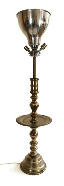 null A bronze and metal table lamp with a turned shaft and an intermediate circular...