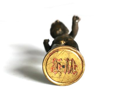 null Bronze seal with brown and gold patina showing a blindfolded love

Figured "M...