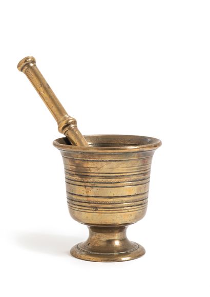 null Mortar on pedestal in bronze and its pestle decorated with friezes of circular...