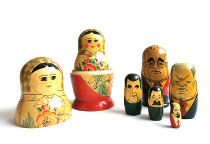 null Two matriochkas in painted wood, one representing the leaders of the USSR

H....
