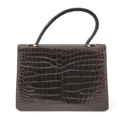 null QUEEN ASTRID

Imitation alligator handbag

H. without handle 21,5 x W. 30,5...