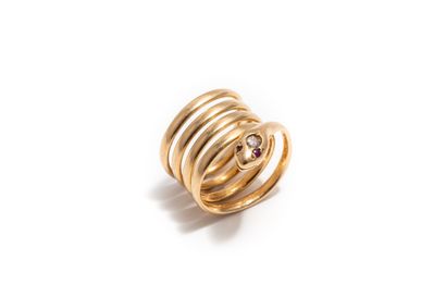 null Snake ring in 18K yellow gold (750 thousandths), the eyes are set with rubies,...