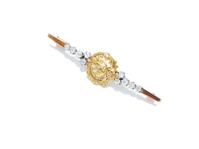 null Barrette brooch in yellow and 18K gold (750 thousandths) and platinum (950 thousandths),...