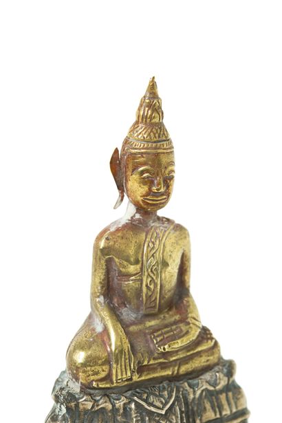 null Cambodia, 19th century 

A gold embossed Buddha figure, depicted seated in padmasana...